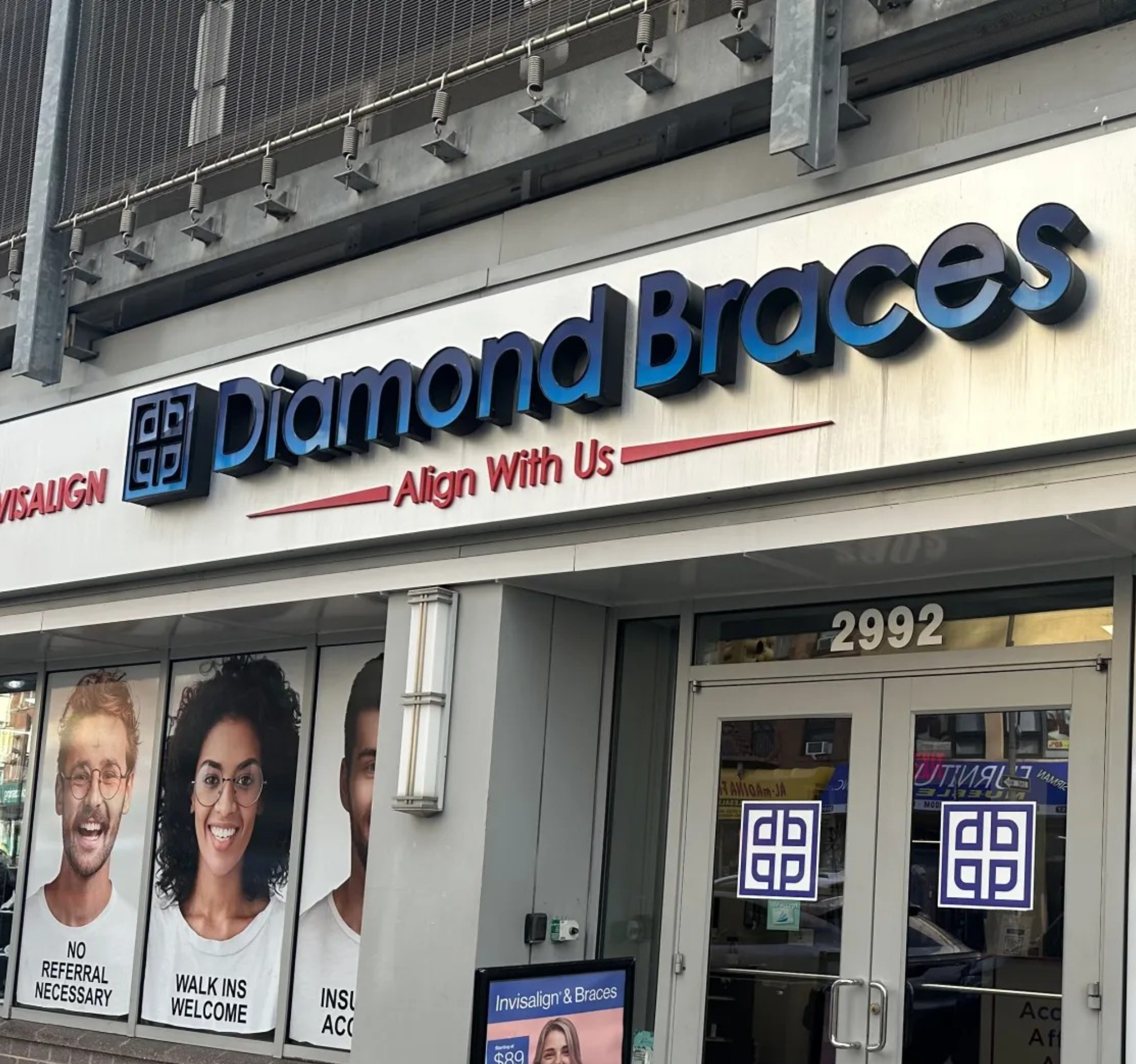 Diamond Braces dental office exterior with branding and promotional materials.