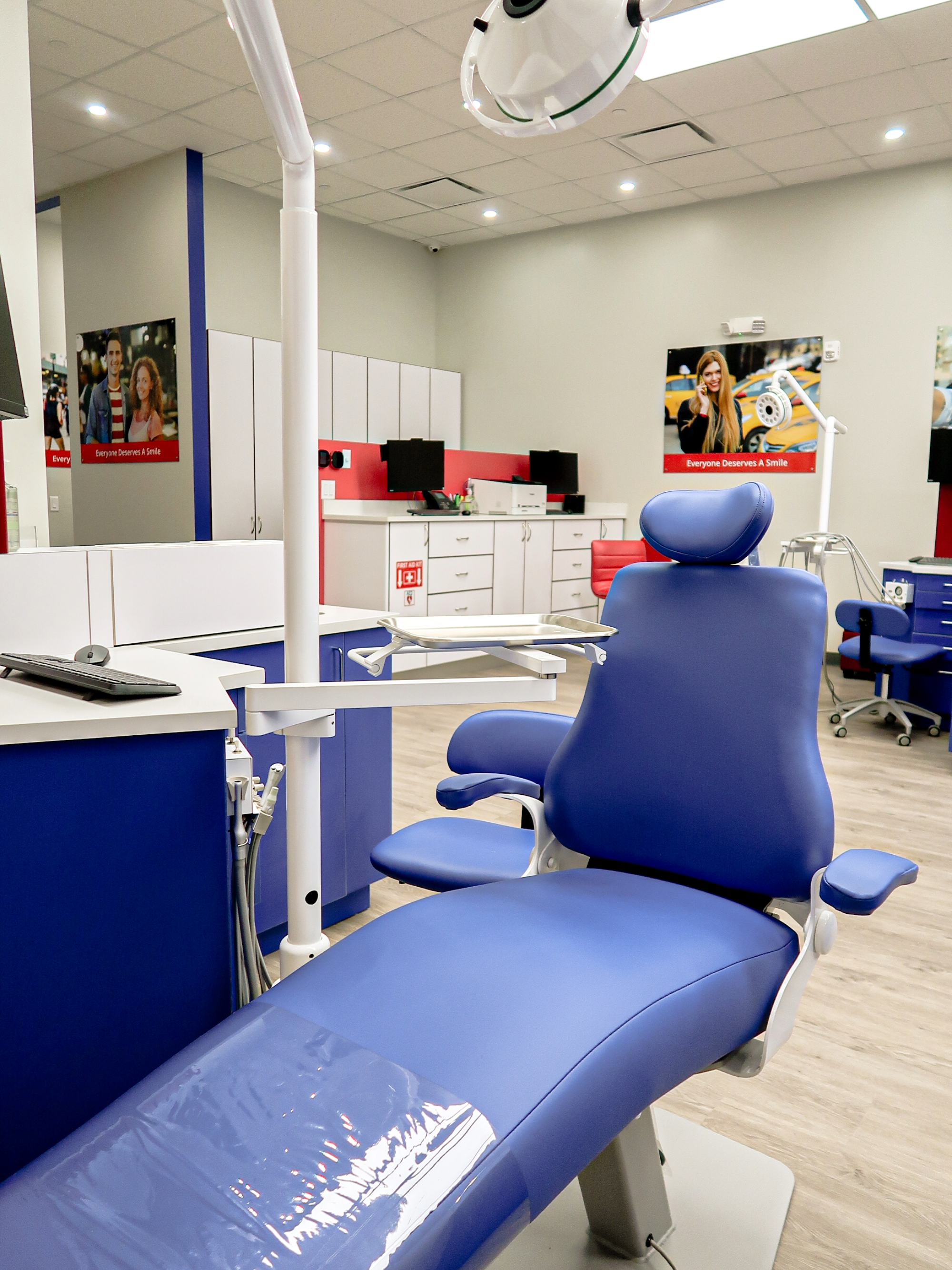 Dental office interior with blue patient chair and examination table found in Diamond Braces.