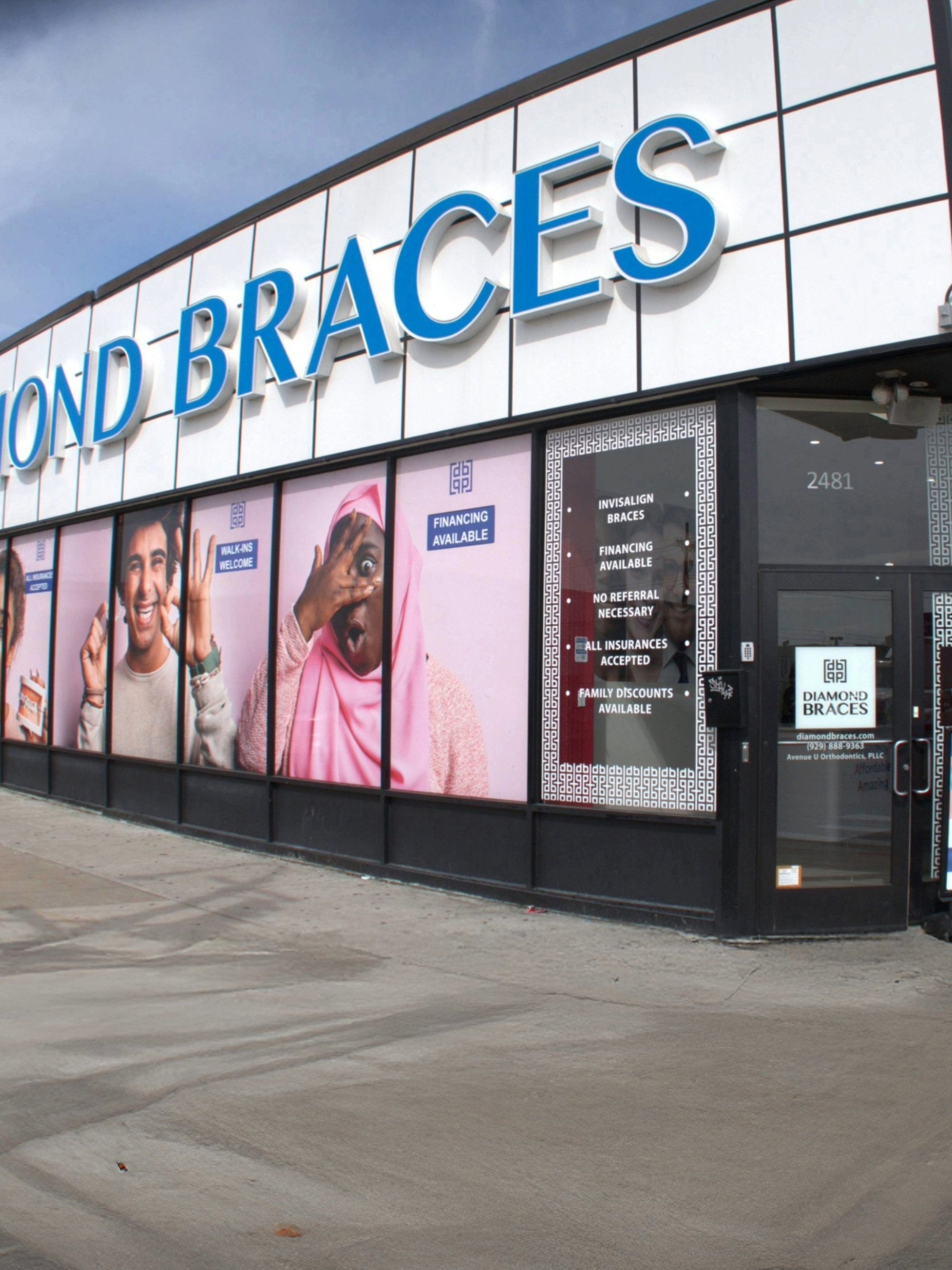 Exterior of a Diamond Braces dental clinic with promotional posters for Clear aligners and metal braces for kids.