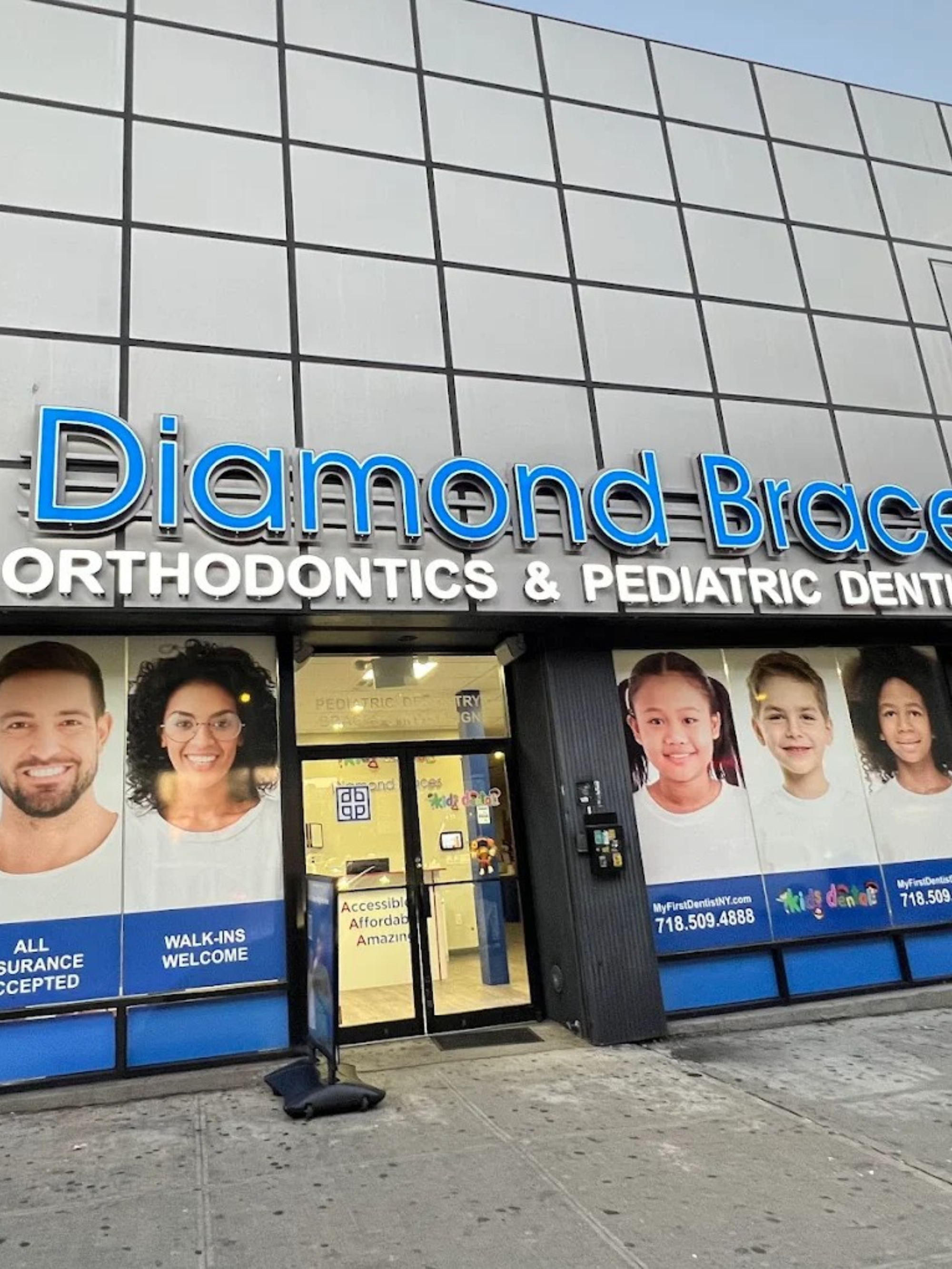 Diamond Braces Orthodontics & Pediatric Dentistry exterior with promotional posters for Invisalign clear aligners and braces on a building facade in Brooklyn.