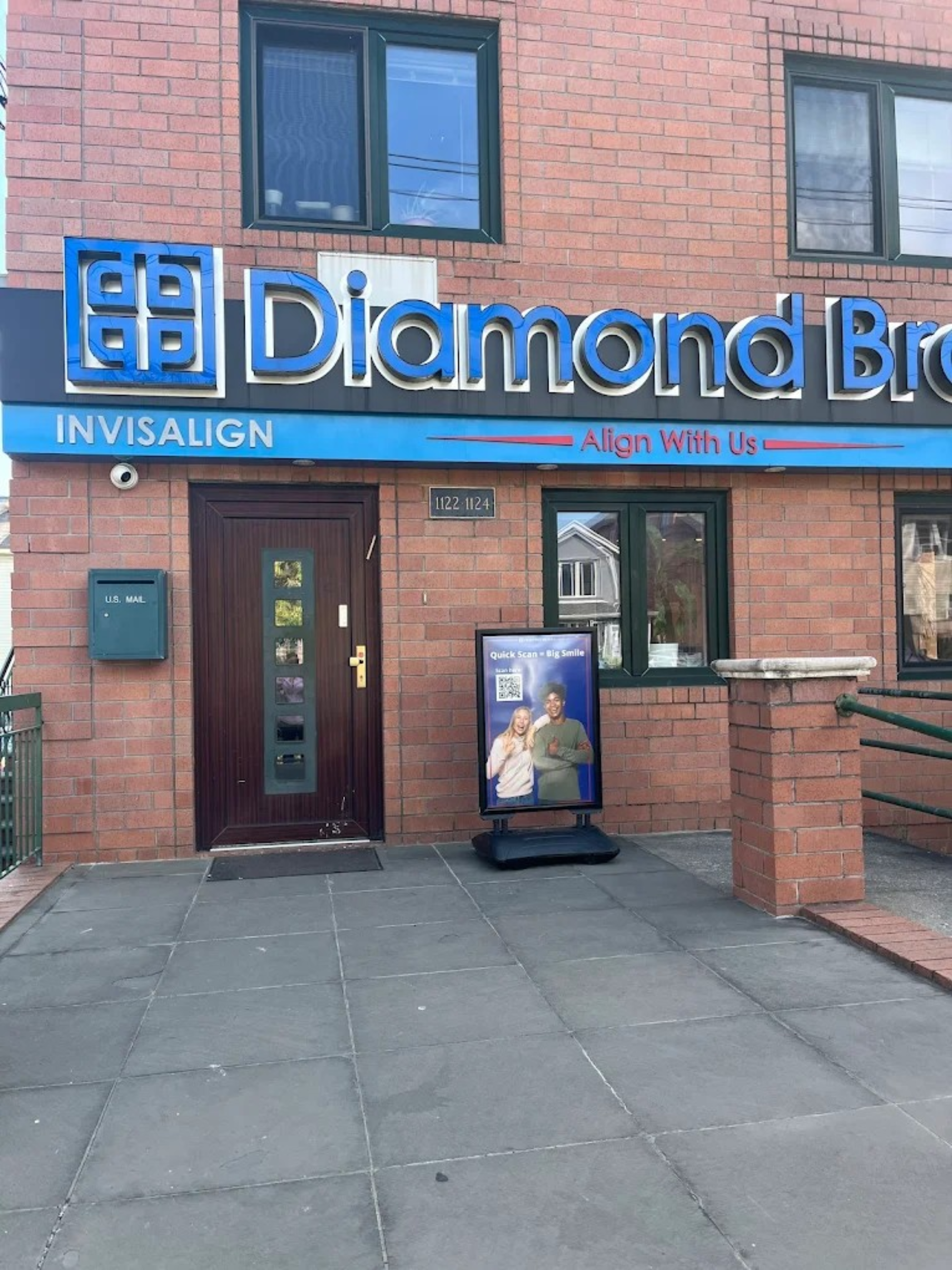 Diamond Braces dental practice entrance with blue signage in Brooklyn.