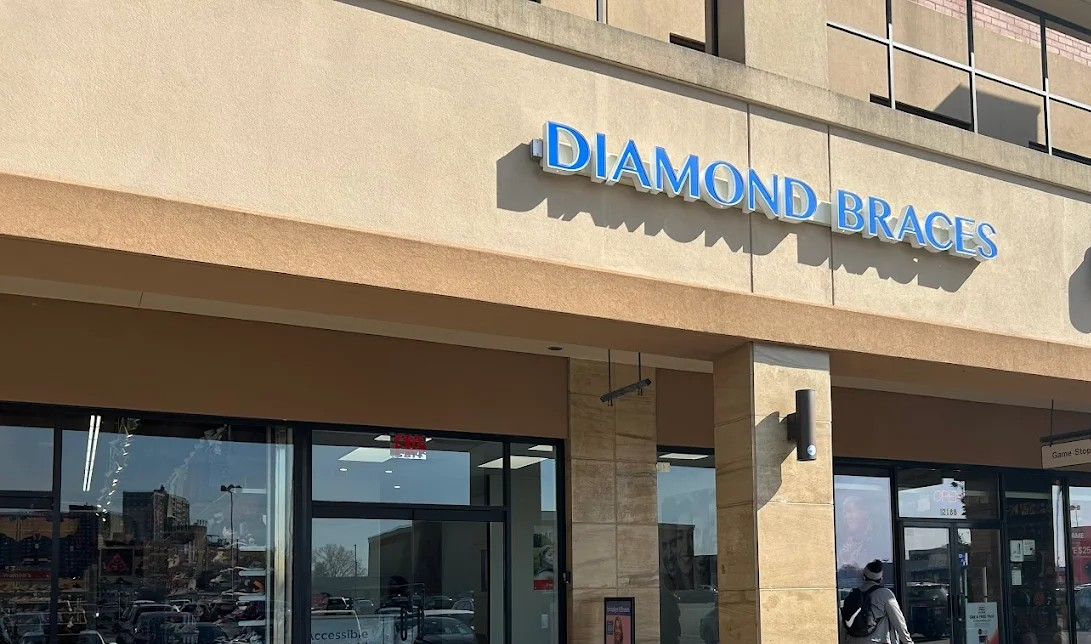 Diamond Braces dentist office store front with blue signage on a beige building in Bronx, New York.