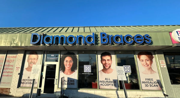 Diamond Braces dental practice with promotional posters on the window in Staten Island.