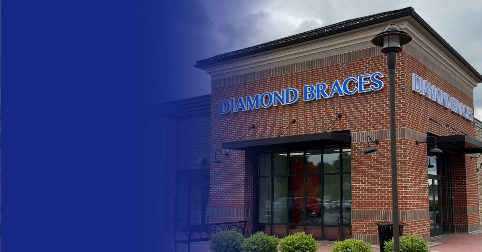 Diamond Braces dental office building with blue signage against a cloudy sky.