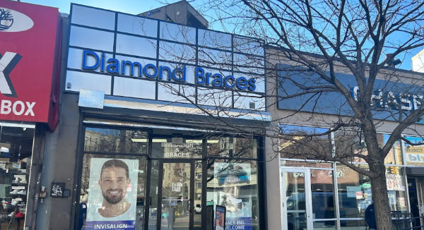 Diamond Braces dental care office with a clear glass facade and visible branding in Bronx.
