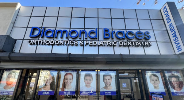 Diamond Braces orthodontics and pediatric dentistry clinic exterior in Flatbush with large sign and images of people.