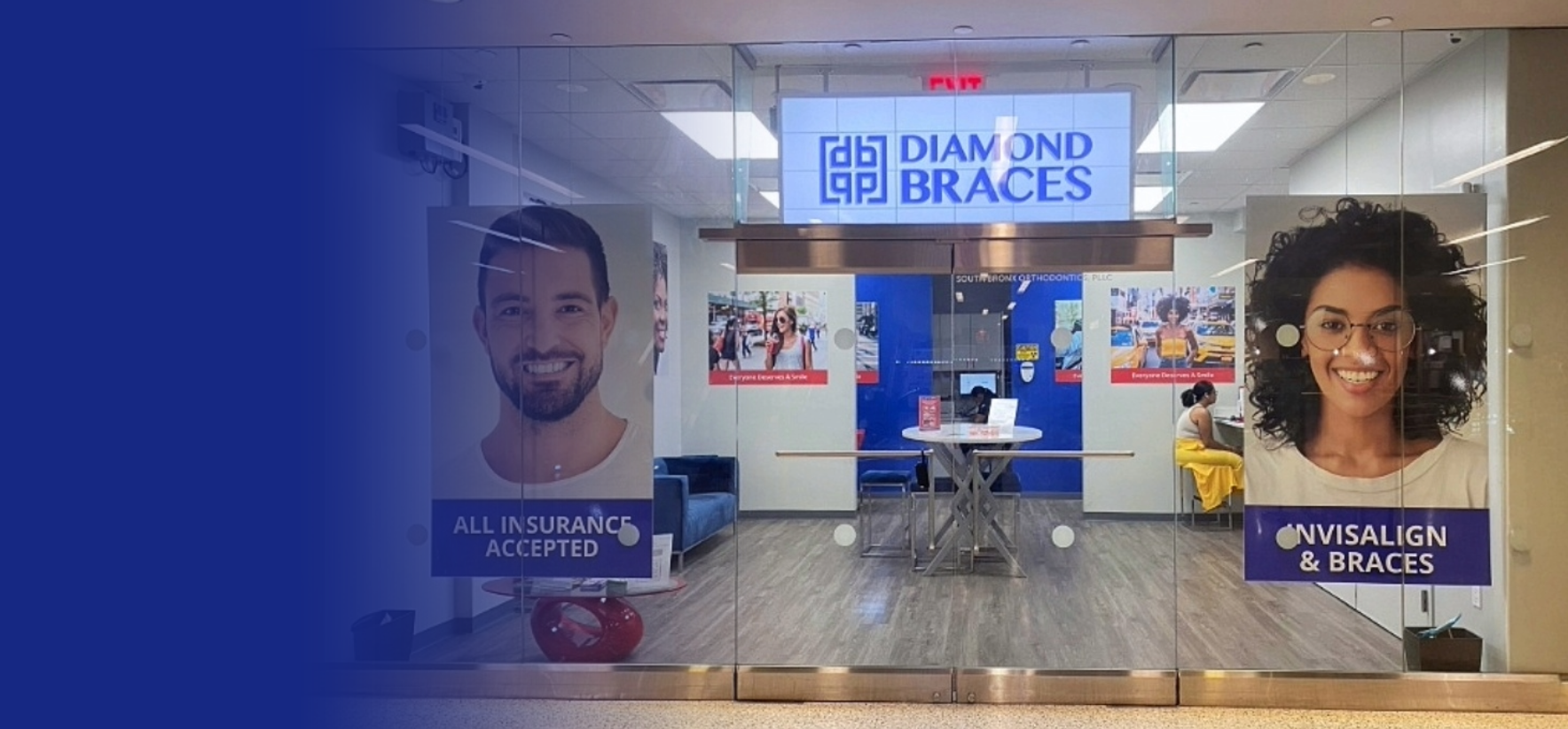 Diamond Braces dentist office entrance with promotional posters on a glass wall.