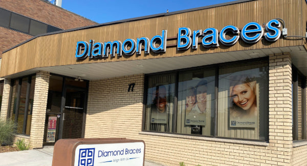 Diamond Braces dental office with blue signage and window displays in Hackensack, New Jersey.