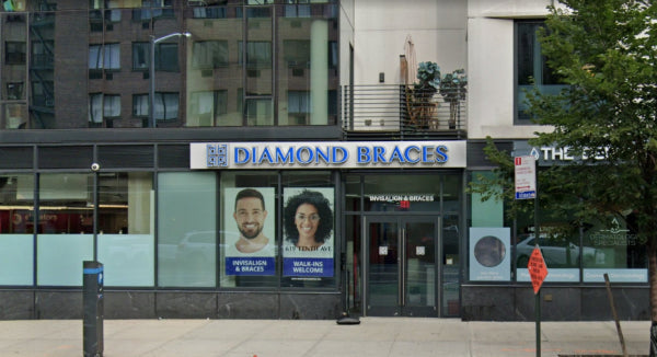Diamond Braces dentist office exterior with glass windows and branding in Manhattan.