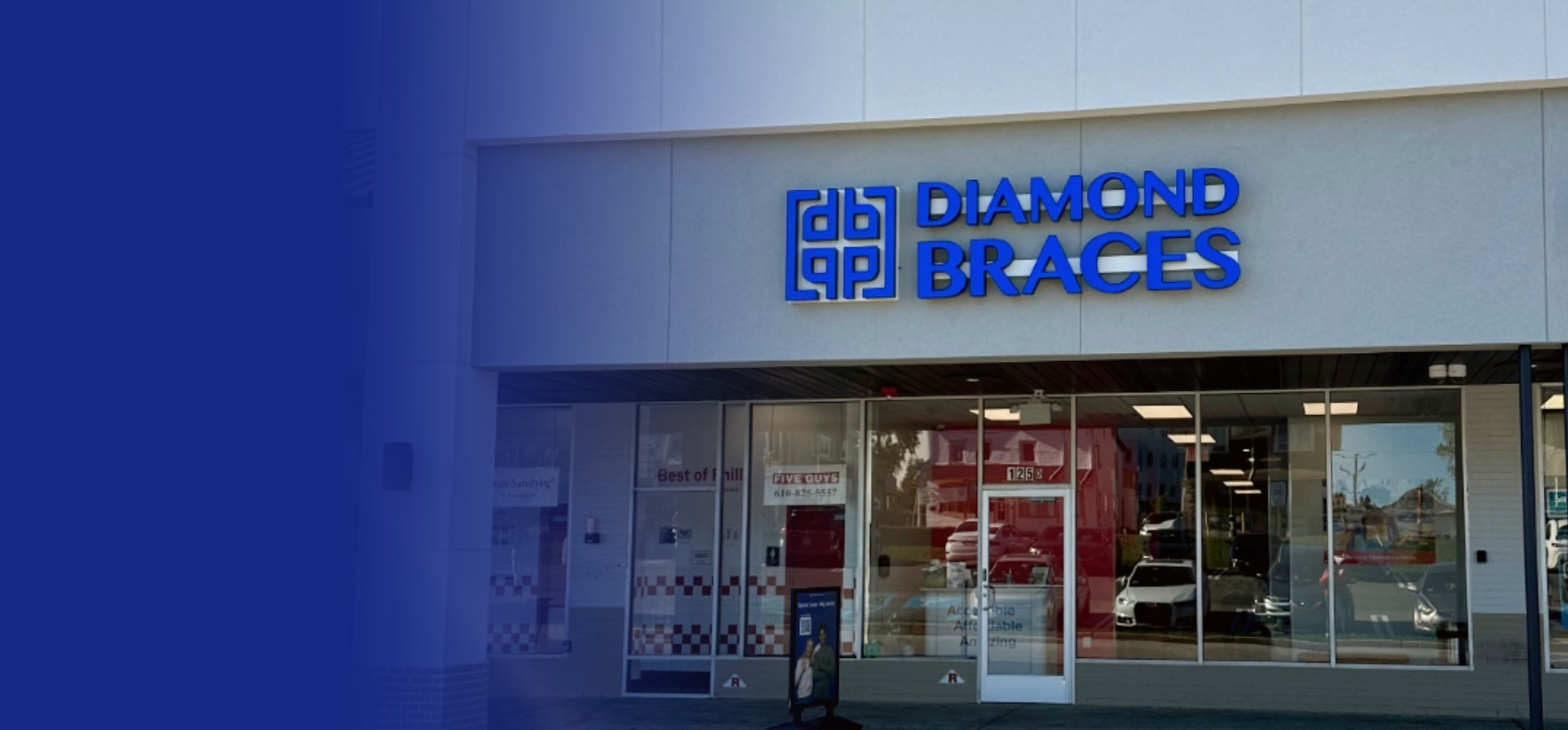 Diamond Braces dental practice with blue logo on a building in a Conshohocken strip mall.