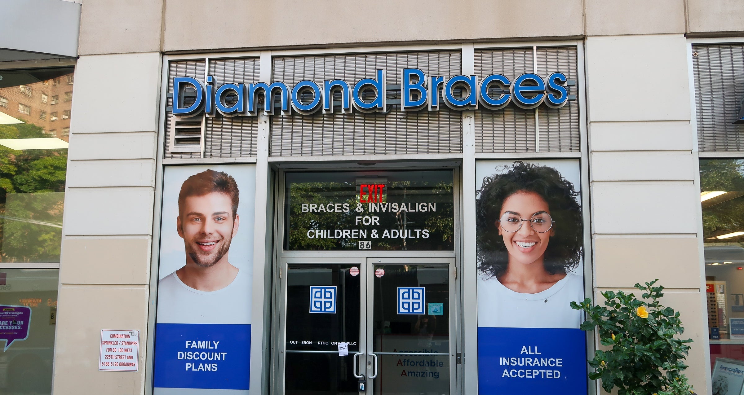 Diamond Braces orthodontist office entrance with promotional posters on a building facade in Flourtown, Pennsylvania.