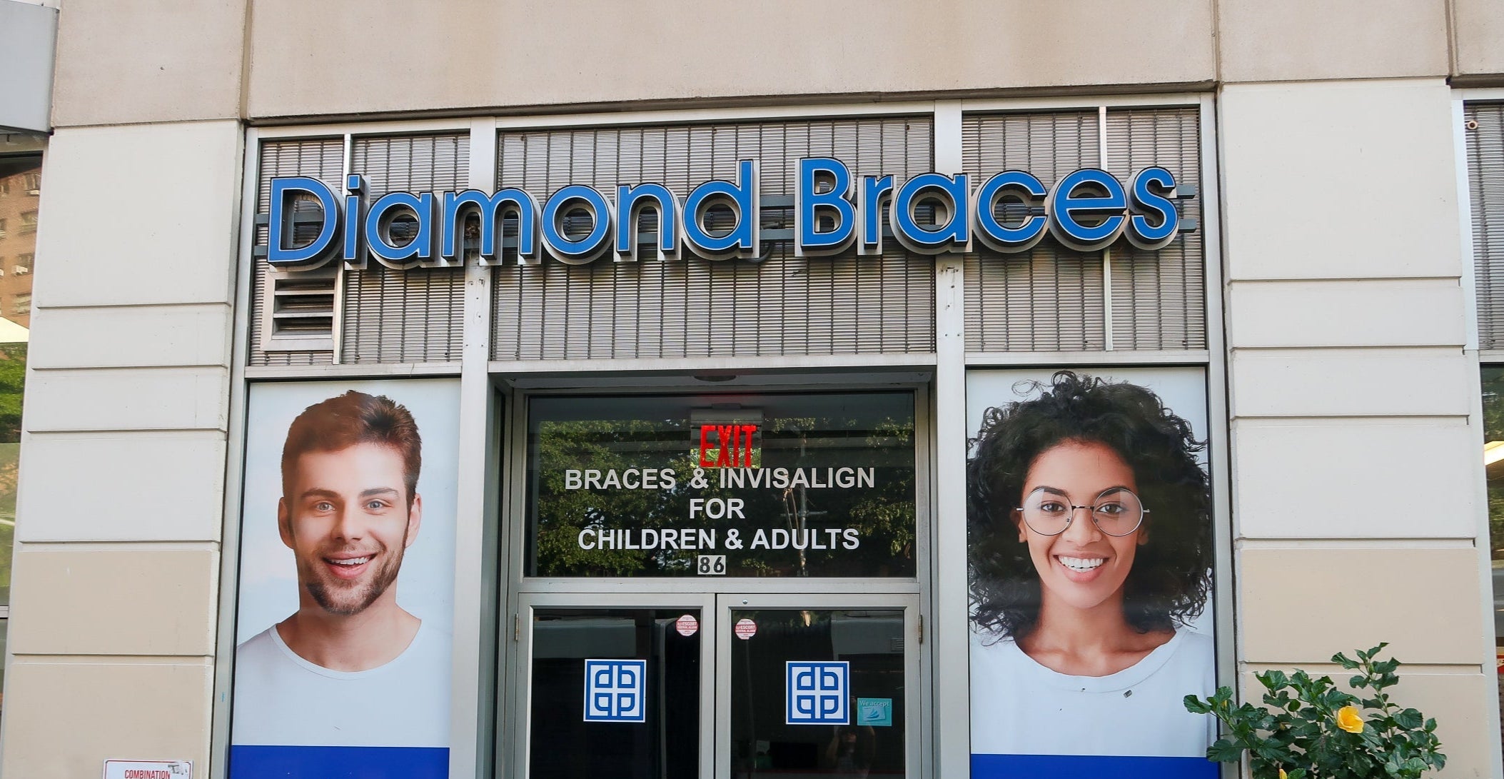 Diamond Braces dental care office entrance with promotional posters and branding in Brooklyn.