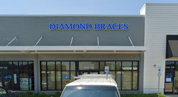 Diamond Braces dentist office building in Old Bridge New Jersey with clear blue sky.