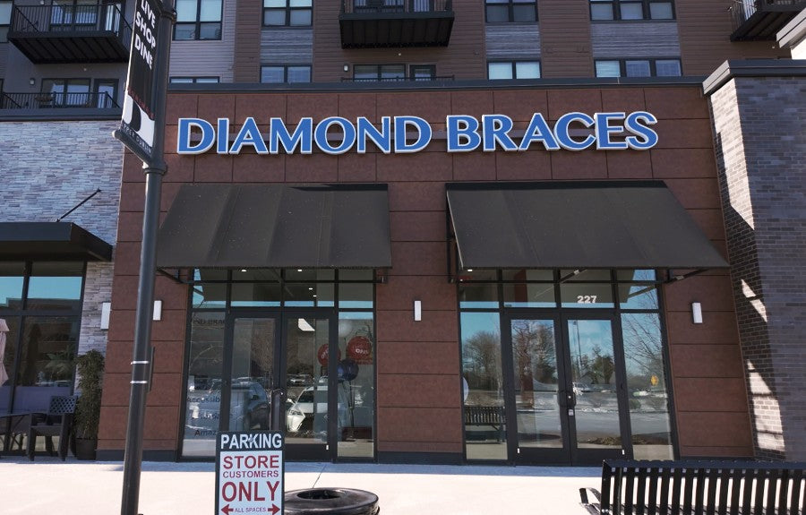 Diamond Braces orthodontist office with blue signage on a brick building in Dresher, Pennsylvania.