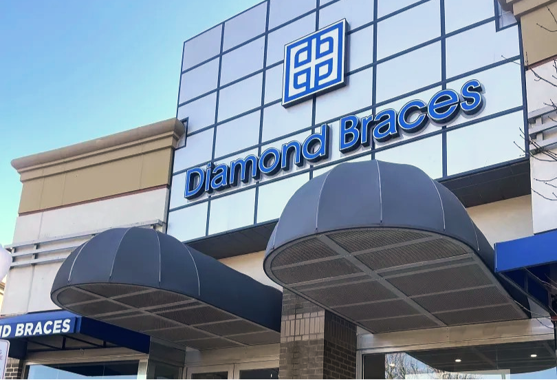 Diamond Braces dental care clinic with blue signage and awnings in Stamford, CT.